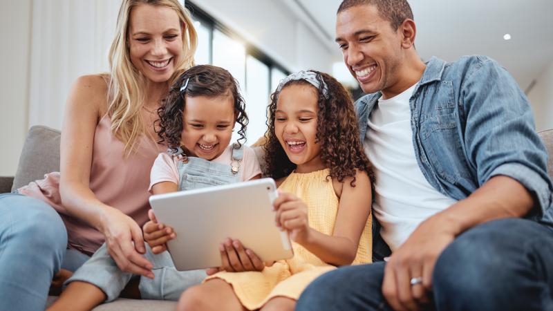 young kids laughing with parents